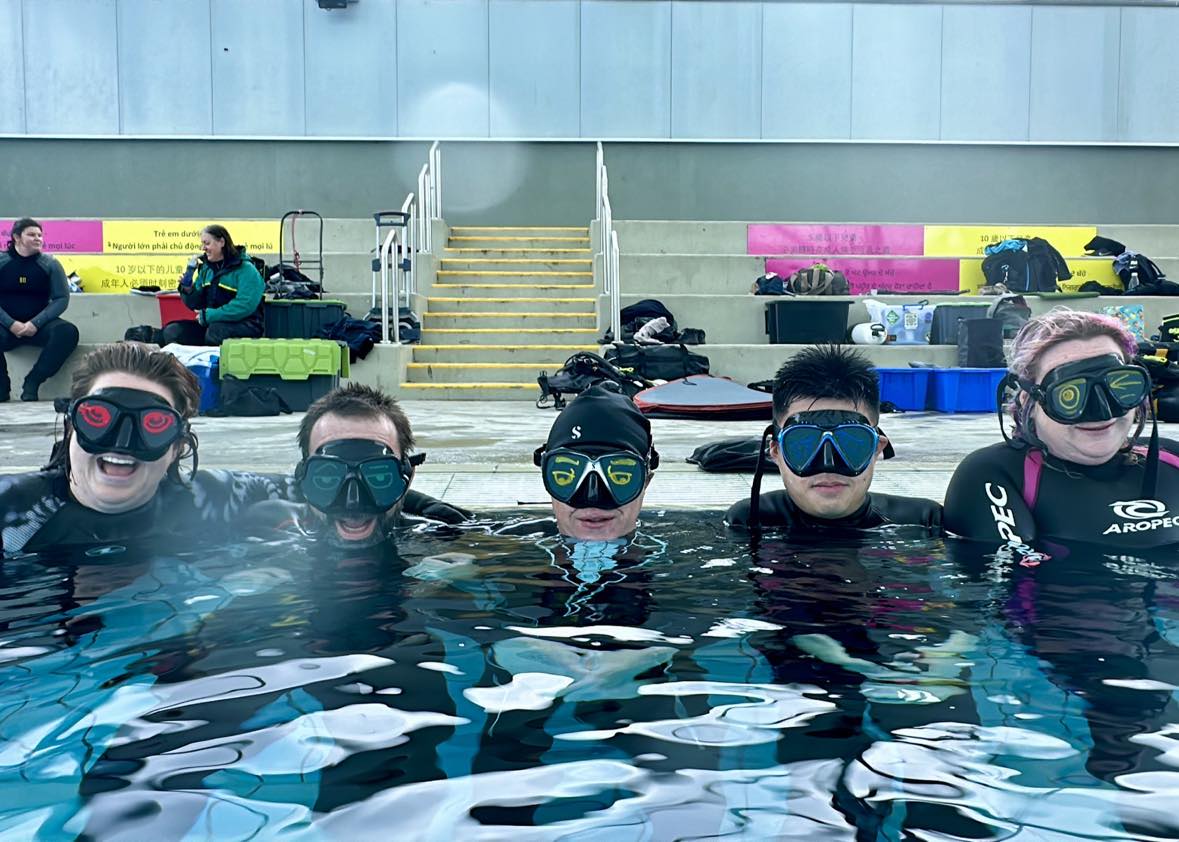 Divers practicing different visual impairments